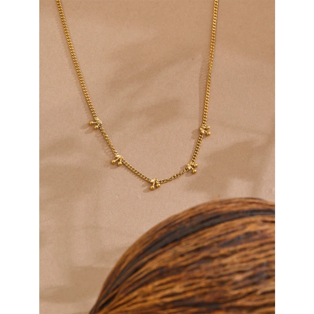 Golden Droplets Necklace - Cardi Bella