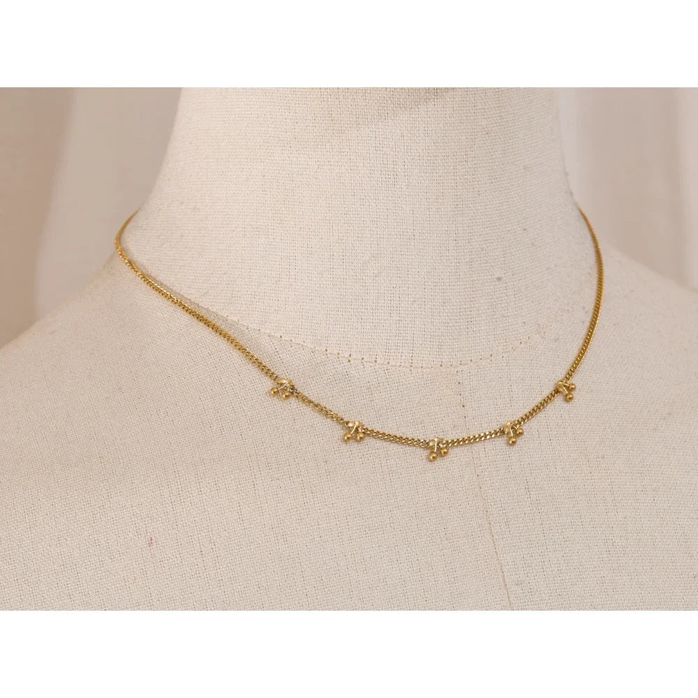 Golden Droplets Necklace - Cardi Bella